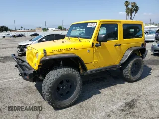 2015 Jeep Wrangler Rubicon Hard Rock z VIN 1C4BJWCG6FL568665, wystawiony jako Copart lot #60282155 z przebiegiem 107 773 mil mil oraz Szkoda całkowita • Salvage title. Historia ofert i sprzedaży dostępna na DreamBid. Obrazek 1.