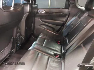2015 Jeep Grand Cherokee Overland with VIN 1C4RJFCG1FC215426, listed as a IAAI auction lot 41689821 with 128,563 mi miles. Bid and sale history available at carsss.com. Image 8.
