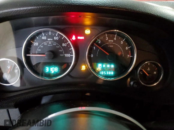 2012 Jeep Wrangler Sport with VIN 1C4AJWAG5CL233049, listed as a Copart auction lot 52328865 with 185,388 mi miles and Salvage title. Bid and sale history available at DreamBid. Image 9.