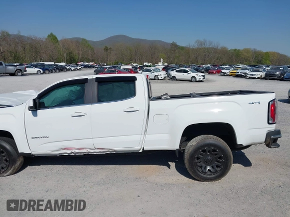 2019 GMC Canyon 4WD SLE z VIN 1GTG6CEN0K1353094, wystawiony jako IAAI lot #42065160 z przebiegiem 73 235 mil mil oraz . Historia ofert i sprzedaży dostępna na DreamBid. Obrazek 14.