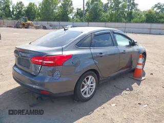 2016 Ford Focus SE with VIN 1FADP3F23GL392347, listed as a IAAI auction lot 39951722 with 143,679 mi miles. Bid and sale history available at carsss.com. Image 4.