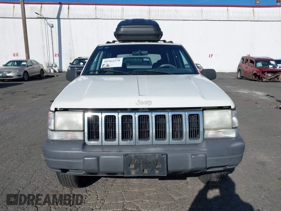1996 Jeep Grand Cherokee Laredo z VIN 1J4GZ58Y5TC186403, wystawiony jako IAAI lot #41562270 z przebiegiem 205 797 mil mil oraz . Historia ofert i sprzedaży dostępna na DreamBid. Obrazek 6.