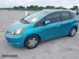 2013 Honda Fit with VIN JHMGE8H3XDC047486, listed as a IAAI auction lot 41543068 with 73,414 mi miles. Bid and sale history available at carsss.com. Image 2.
