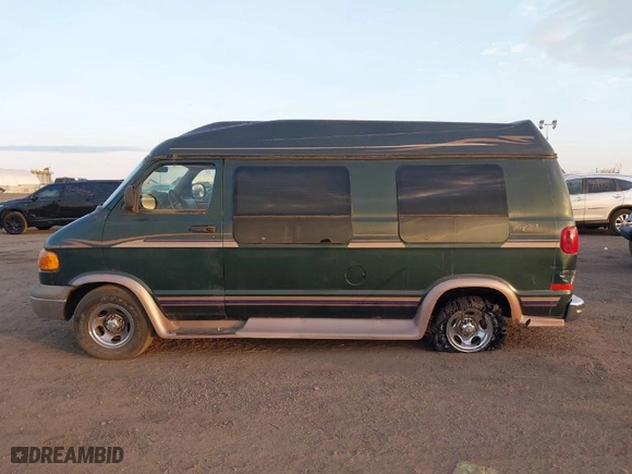 1999 Dodge Ram Van Conversion with VIN 2B6HB11Y8XK546999, listed as a IAAI auction lot 40672821 with NaN miles. Bid and sale history available at carsss.com. Image 14.