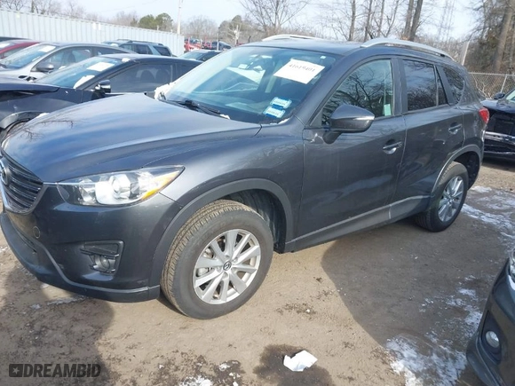 2016 Mazda CX-5 Touring with VIN JM3KE2CY6G0910986, listed as a IAAI auction lot 41619401 with NaN miles. Bid and sale history available at carsss.com. Image 2.