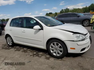 2009 Volkswagen Rabbit S with VIN WVWDB71K79W085935, listed as a Copart auction lot 60697594 with 102,780 mi miles and Salvage title. Bid and sale history available at DreamBid. Image 4.