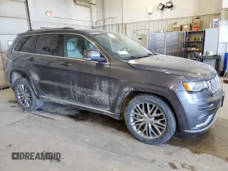 2017 Jeep Grand Cherokee Summit with VIN 1C4RJFJT4HC723876, listed as a Copart auction lot 52647205 with 97,412 mi miles and Salvage title. Bid and sale history available at DreamBid. Image 4.