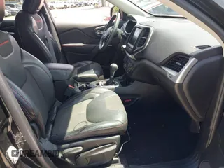 2017 Jeep Cherokee Trailhawk with VIN 1C4PJMBS9HW537962, listed as a IAAI auction lot 42002460 with 129,037 mi miles and . Bid and sale history available at DreamBid. Image 5.