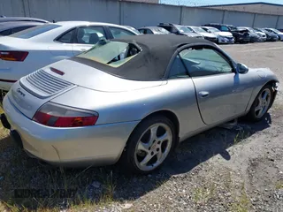 1999 Porsche 911 with VIN WP0CA2999XS652816, listed as a IAAI auction lot 41975822 with 291,258 mi miles and . Bid and sale history available at DreamBid. Image 4.