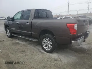 2016 Nissan Titan XD Platinum Reserve with VIN 1N6BA1F2XGN501136, listed as a Copart auction lot 82671694 with 79,469 mi miles and Salvage Title. Bid and sale history available at carsss.com. Image 2.