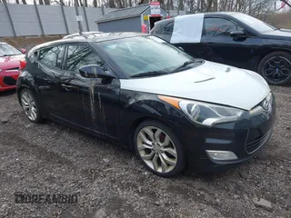 2012 Hyundai Veloster w/Black Int z VIN KMHTC6AD6CU020657, wystawiony jako IAAI lot #42031670 z przebiegiem 187 585 mil mil oraz . Historia ofert i sprzedaży dostępna na DreamBid. Obrazek 1.