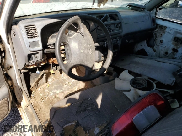 1998 Nissan Frontier XE with VIN 1N6DD21S9WC357098, listed as a Copart auction lot 77652604 with Not provided miles and Clean title. Bid and sale history available at DreamBid. Image 8.