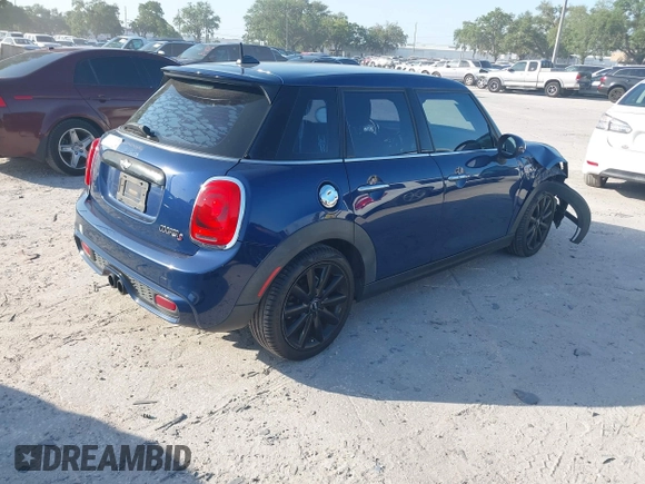 2016 MINI Cooper Hardtop 4 Door S with VIN WMWXU3C54G2D30766, listed as a IAAI auction lot 42008026 with 101,898 mi miles. Bid and sale history available at carsss.com. Image 4.