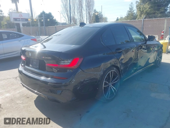 2022 BMW 3 Series M340i with VIN 3MW5U7J02N8C22521, listed as a IAAI auction lot 41776890 with 66,055 mi miles. Bid and sale history available at carsss.com. Image 4.