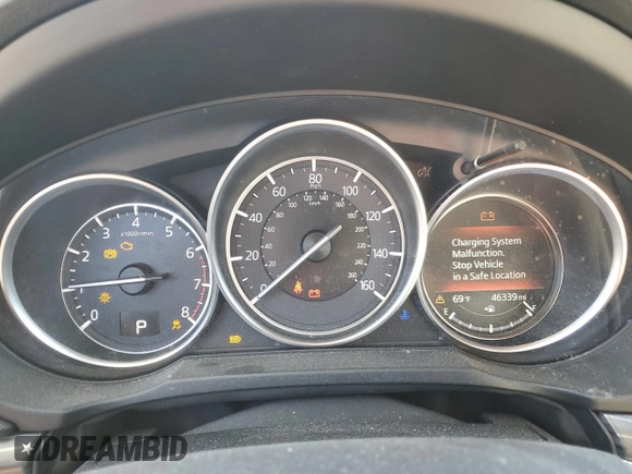 2018 Mazda CX-5 Grand Touring z VIN JM3KFBDM5J0379246, wystawiony jako Copart lot #58587865 z przebiegiem 46 339 mil mil oraz Szkody całkowita. Historia ofert i sprzedaży dostępna na DreamBid. Obrazek 9.