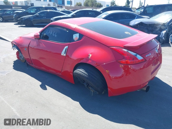 2014 Nissan 370Z Nismo with VIN JN1AZ4EH9EM636306, listed as a IAAI auction lot 41467766 with 101,021 mi miles and . Bid and sale history available at DreamBid. Image 3.