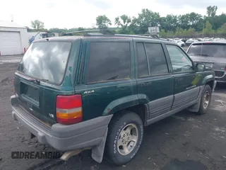 1996 Jeep Grand Cherokee with VIN 1J4EZ58Y7TC128302, listed as a IAAI auction lot 42643449 with 282,036 mi miles and . Bid and sale history available at DreamBid. Image 4.