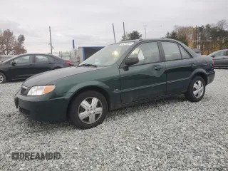 2001 Mazda Protege DX with VIN JM1BJ222010447414, listed as a Copart auction lot 81344584 with 195,931 mi miles and Salvage Title. Bid and sale history available at DreamBid. Image 1.