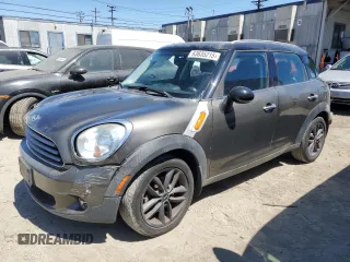 2014 MINI Countryman with VIN WMWZB3C54EWR39731, listed as a Copart auction lot 63635215 with 85,751 mi miles and Salvage title. Bid and sale history available at DreamBid. Image 1.