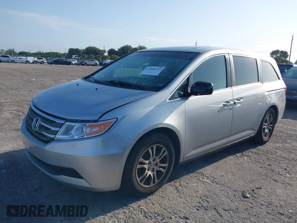 2013 Honda Odyssey EX-L with VIN 5FNRL5H67DB008575, listed as a IAAI auction lot 42008315 with 131,984 mi miles and . Bid and sale history available at carsss.com. Image 2.