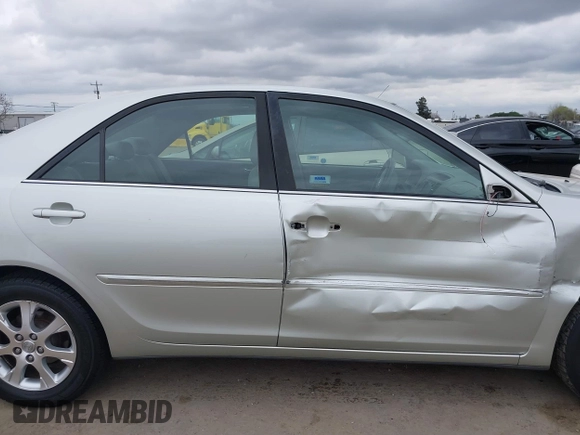 2005 Toyota Camry LE with VIN JTDBF30K650163057, listed as a IAAI auction lot 41730270 with 98,300 mi miles and . Bid and sale history available at DreamBid. Image 13.