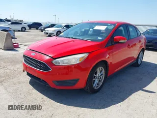 2016 Ford Focus SE with VIN 1FADP3F2XGL205797, listed as a IAAI auction lot 41987209 with 129,042 mi miles. Bid and sale history available at carsss.com. Image 2.