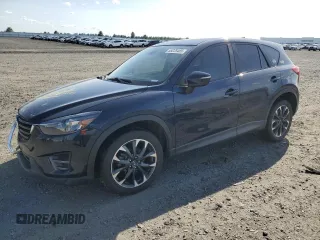 2016 Mazda CX-5 Grand Touring z VIN JM3KE4DY3G0872451, wystawiony jako Copart lot #55228485 z przebiegiem 79 330 mil mil oraz Szkoda całkowita • Salvage title. Historia ofert i sprzedaży dostępna na DreamBid. Obrazek 1.