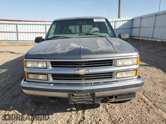 1999 Chevrolet Suburban with VIN 1GNFK16R4XJ483035, listed as a Copart auction lot 76666034 with 215,048 mi miles and Clean Title. Bid and sale history available at carsss.com. Image 5.