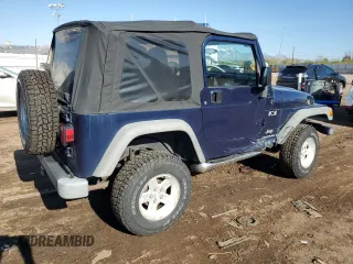 2003 Jeep Wrangler X z VIN 1J4FA39S43P338732, wystawiony jako Copart lot #56315495 z przebiegiem 135 480 mil mil oraz Szkoda całkowita • Salvage title. Historia ofert i sprzedaży dostępna na DreamBid. Obrazek 3.