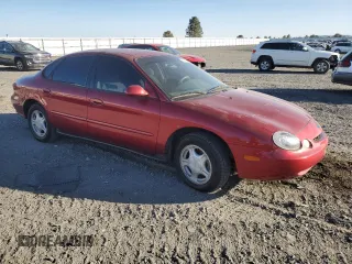 1997 Ford Taurus GL z VIN 1FALP52U6VA301952, wystawiony jako Copart lot #74245204 z przebiegiem 152 562 mil mil oraz Szkody całkowita. Historia ofert i sprzedaży dostępna na DreamBid. Obrazek 4.