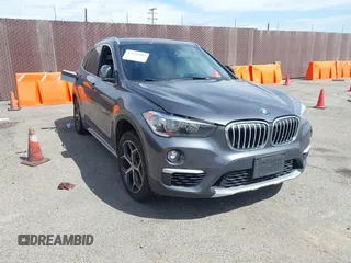 2018 BMW X1 xDrive28i with VIN WBXHT3C30J5L34702, listed as a IAAI auction lot 41935803 with 42,174 mi miles. Bid and sale history available at carsss.com. Image 1.