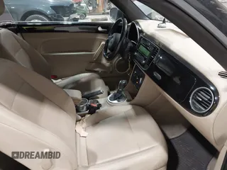 2014 Volkswagen Beetle 1.8T с VIN 3VW517AT5EM818796, выставлен на аукционе IAAI как лот 42318653 с пробегом 150 443 миль миль и . История ставок и продаж доступна на DreamBid. Изображение 5.