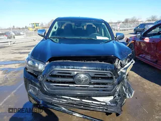 2018 Toyota Tacoma SR with VIN 5TFCZ5ANXJX124991, listed as a IAAI auction lot 41136867 with 57,980 mi miles and . Bid and sale history available at carsss.com. Image 12.