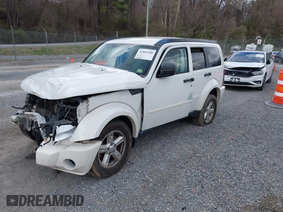 2007 Dodge Nitro SXT with VIN 1D8GU28K77W727391, listed as a IAAI auction lot 41869288 with 214,920 mi miles. Bid and sale history available at carsss.com. Image 2.