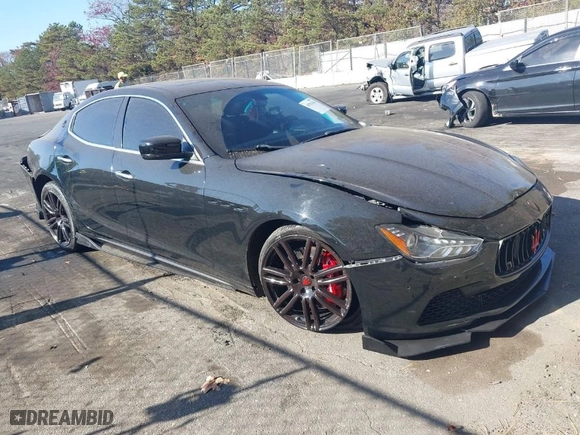 2014 Maserati Ghibli S Q4 with VIN ZAM57RTA9E1106695, listed as a IAAI auction lot 40783416 with 92,885 mi miles. Bid and sale history available at carsss.com. Image 1.