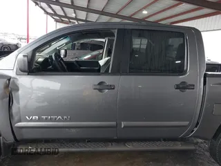 2014 Nissan Titan S with VIN 1N6AA0ECXEN504034, listed as a IAAI auction lot 39883492 with 189,529 mi miles and . Bid and sale history available at DreamBid. Image 13.