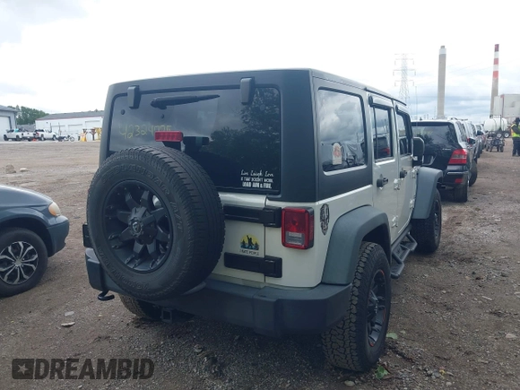 2014 Jeep Wrangler Unlimited Sport with VIN 1C4BJWDG9EL135077, listed as a IAAI auction lot 42324775 with 104,221 mi miles and . Bid and sale history available at DreamBid. Image 4.