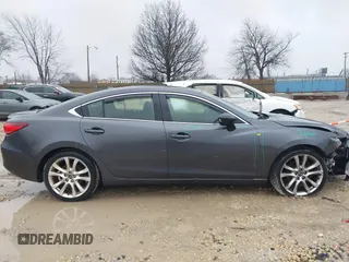 2015 Mazda 6 i Grand Touring with VIN JM1GJ1W56F1207077, listed as a IAAI auction lot 41734641 with 109,447 mi miles and . Bid and sale history available at DreamBid. Image 13.