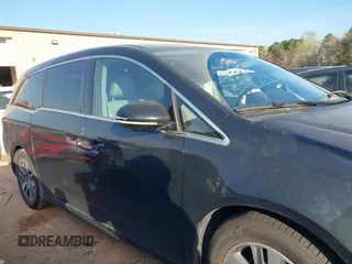 2014 Honda Odyssey Touring with VIN 5FNRL5H90EB077054, listed as a IAAI auction lot 41904456 with 197,869 mi miles and . Bid and sale history available at carsss.com. Image 13.