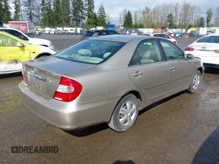 2004 Toyota Camry LE with VIN JTDBE32K440272373, listed as a IAAI auction lot 41949768 with 205,093 mi miles. Bid and sale history available at carsss.com. Image 4.