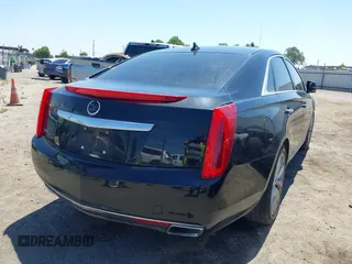 2013 Cadillac XTS Luxury z VIN 2G61R5S32D9226506, wystawiony jako IAAI lot #42208105 z przebiegiem 140 255 mil mil oraz . Historia ofert i sprzedaży dostępna na DreamBid. Obrazek 4.