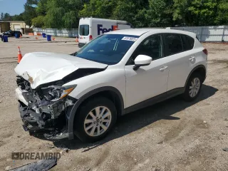 2014 Mazda CX-5 Touring z VIN JM3KE4CY8E0372638, wystawiony jako Copart lot #57076025 z przebiegiem 132 357 mil mil oraz Szkody całkowita. Historia ofert i sprzedaży dostępna na DreamBid. Obrazek 1.