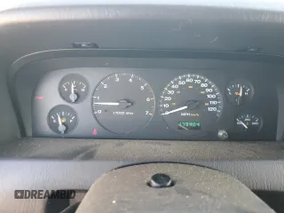 2004 Jeep Grand Cherokee with VIN 1J4GX48JX4C301369, listed as a Copart auction lot 77803094 with 179,404 mi miles and Clean title. Bid and sale history available at DreamBid. Image 9.
