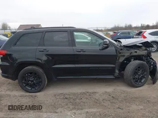 2021 Jeep Grand Cherokee 80th Anniversary with VIN 1C4RJFBG7MC828116, listed as a IAAI auction lot 42118355 with 57,240 mi miles and . Bid and sale history available at DreamBid. Image 14.