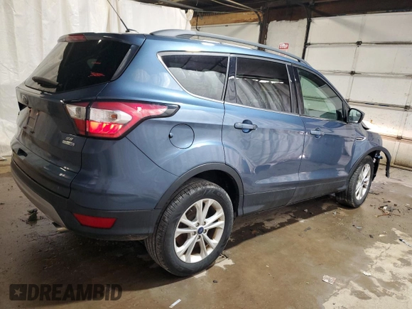 2018 Ford Escape SE z VIN 1FMCU9GD6JUC30324, wystawiony jako Copart lot #55833765 z przebiegiem 48 016 mil mil oraz Szkoda całkowita • Salvage title. Historia ofert i sprzedaży dostępna na DreamBid. Obrazek 3.