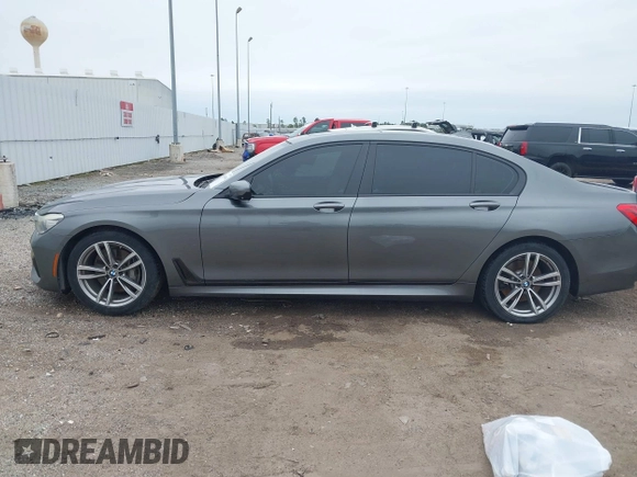2016 BMW 7 Series 740i with VIN WBA7E2C56GG546920, listed as a IAAI auction lot 41610698 with 119,689 mi miles. Bid and sale history available at carsss.com. Image 14.