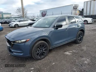 2021 Mazda CX-5 Touring with VIN JM3KFBCM5M0483547, listed as a IAAI auction lot 41683694 with 55,791 mi miles. Bid and sale history available at carsss.com. Image 17.