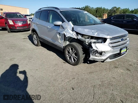 2018 Ford Escape SE z VIN 1FMCU9G96JUB49271, wystawiony jako Copart lot #50553205 z przebiegiem 91 123 mil mil oraz Szkoda całkowita • Salvage title. Historia ofert i sprzedaży dostępna na DreamBid. Obrazek 10.