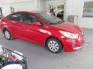 2015 Hyundai Accent GLS with VIN KMHCT4AE2FU888995, listed as a IAAI auction lot 42145256 with 160,918 mi miles. Bid and sale history available at carsss.com. Image 1.