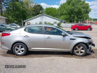 2015 Kia Optima LX z VIN 5XXGM4A70FG392359, wystawiony jako IAAI lot #42232025 z przebiegiem 192 636 mil mil oraz . Historia ofert i sprzedaży dostępna na DreamBid. Obrazek 14.